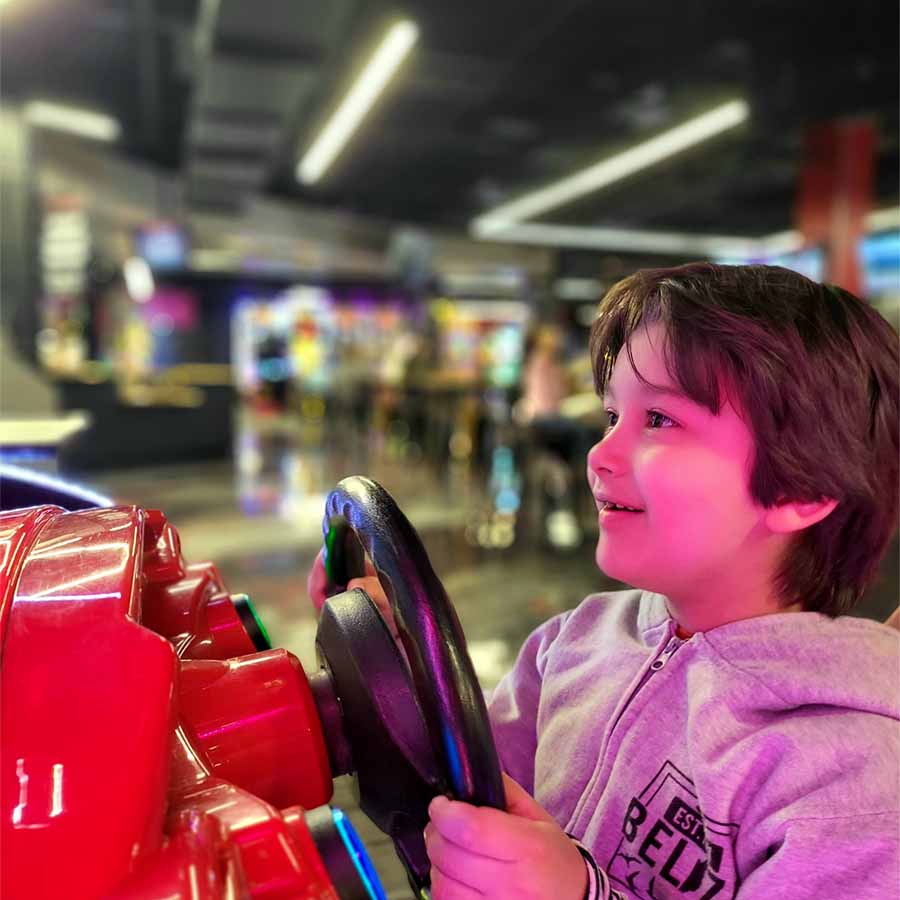 Josh's nephew Solomon plays an arcade game