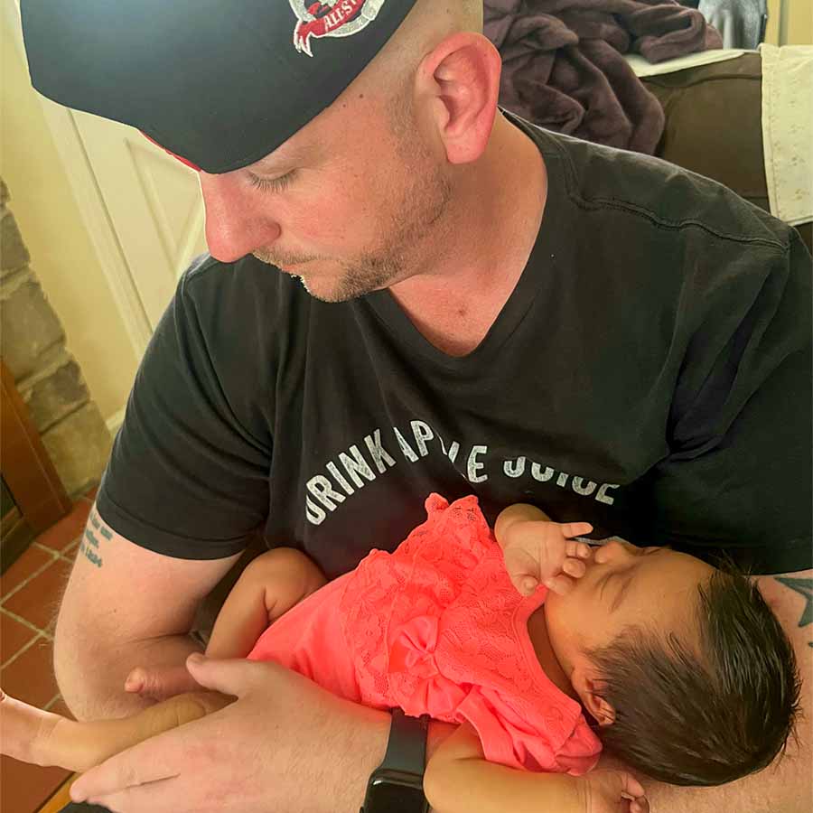 A candid photo of Josh's Brother Nick and Neice Luna